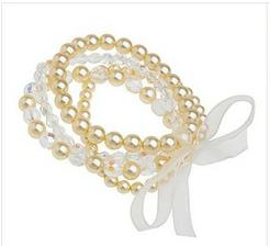 Set of four cream pearl ribbon tie bracelet