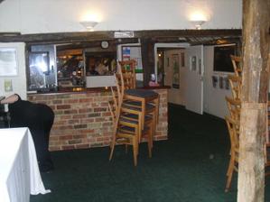 The bar area, next to where we will dance to ensure the men can be dragged to dance