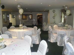 Here it is decorated for another wedding - too little colour for me. through those double doors is the lovely beamed area for the DJ