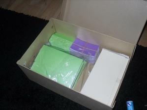 My card blanks - 30 so far, need to do 40 more. Also place cards already punched and embossed