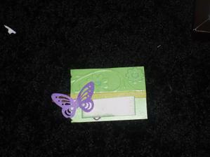 The other side will have one purple butterfly, orange ribbon, name with green glitter around the edge.