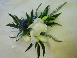 Corsage. Rose and Thistle Corsage with White Heather and Freesia.