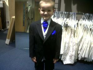 my oldest in his suit, lookin all proud